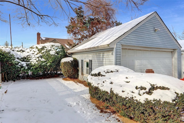 view of snow covered garage