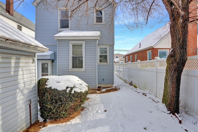 view of snow covered house