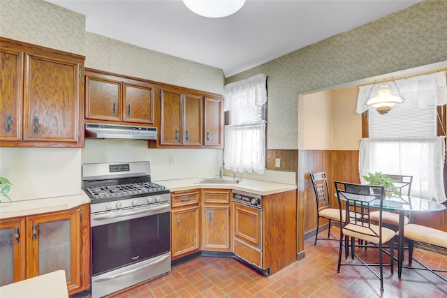 kitchen featuring sink and stainless steel gas range oven