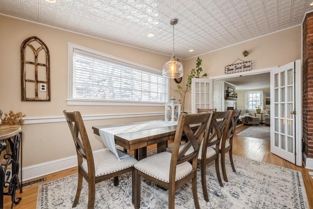 dining room featuring light hardwood / wood-style floors and french doors