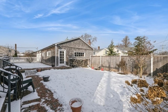 view of snow covered property