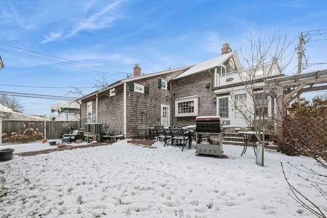 view of snow covered house