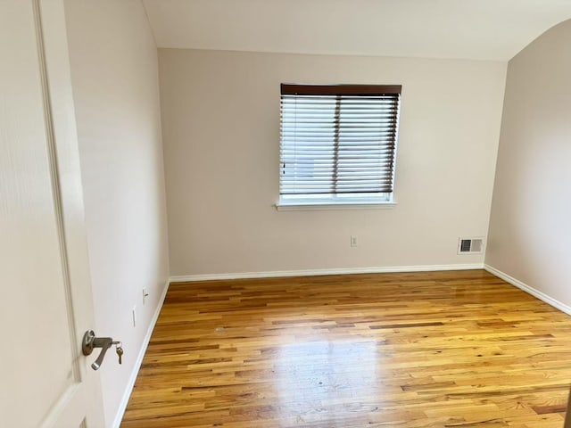 spare room featuring light hardwood / wood-style floors