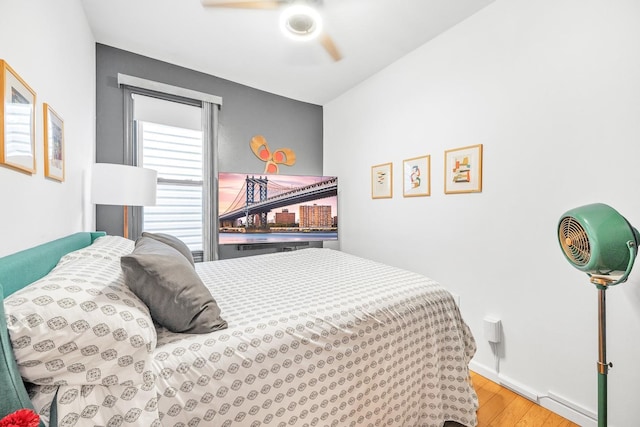 bedroom featuring ceiling fan and light wood-type flooring