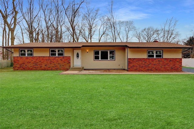 ranch-style home featuring a front yard