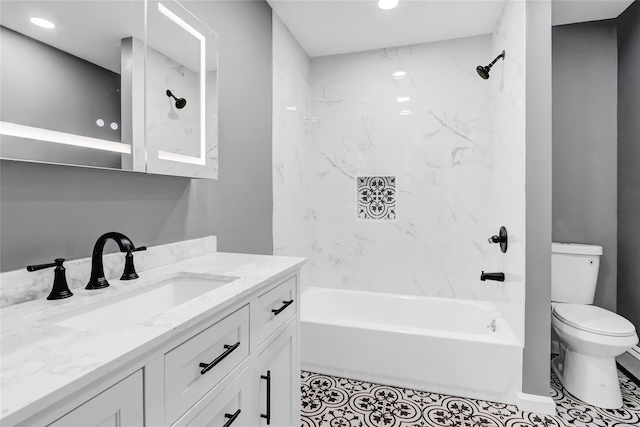 full bathroom with tiled shower / bath combo, vanity, and toilet