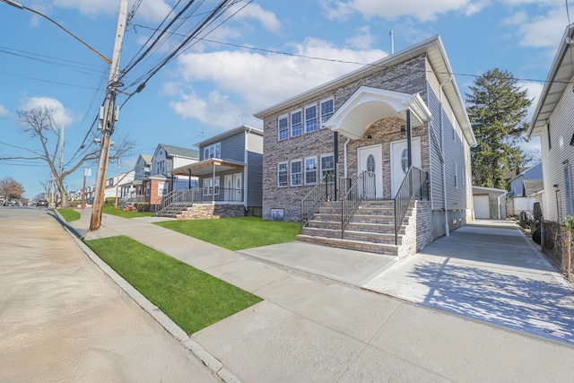 view of front of home with an outbuilding and a garage