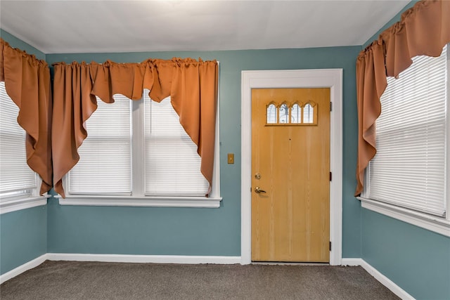 carpeted entryway with plenty of natural light