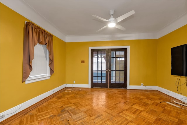 empty room with light parquet floors, french doors, and ceiling fan