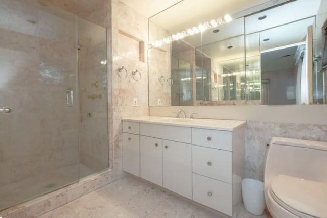 bathroom with walk in shower, tile walls, vanity, and toilet