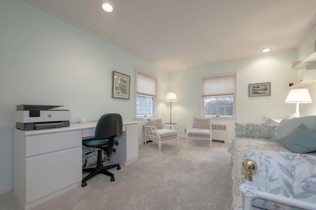 office area with ornamental molding, radiator, and light carpet