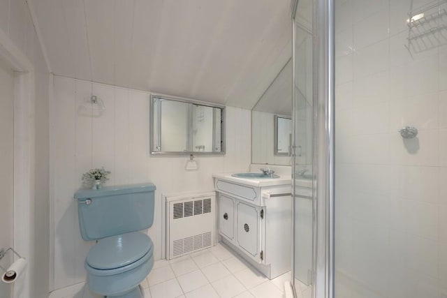 bathroom featuring toilet, vanity, radiator, a shower with door, and tile patterned flooring