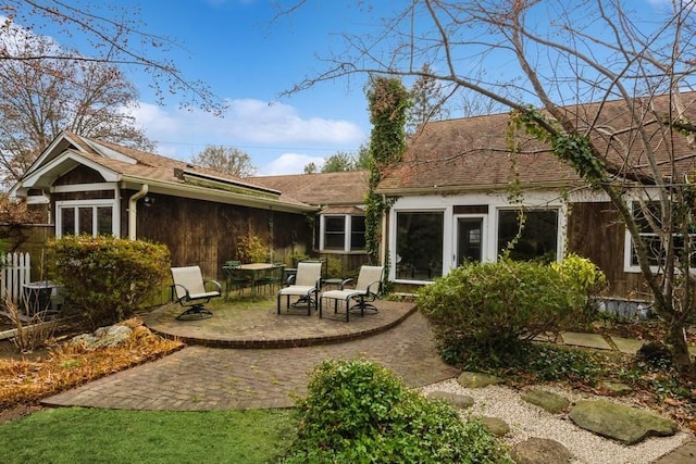 back of property featuring a patio area