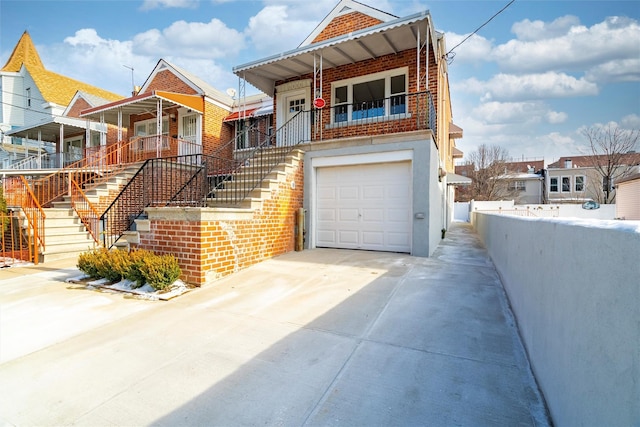 view of front of property featuring a garage and covered porch