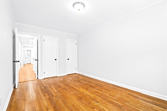 unfurnished bedroom featuring hardwood / wood-style floors