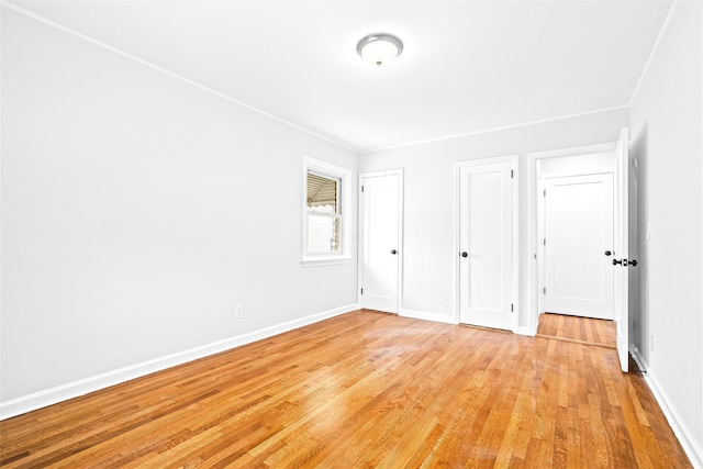 unfurnished bedroom with light hardwood / wood-style floors