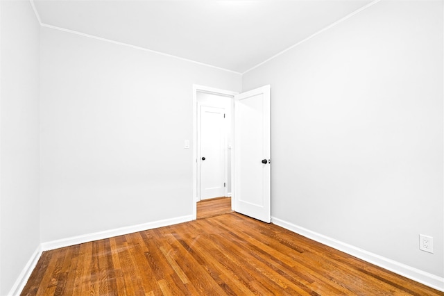 spare room with wood-type flooring