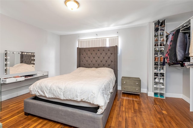 bedroom featuring dark wood-type flooring