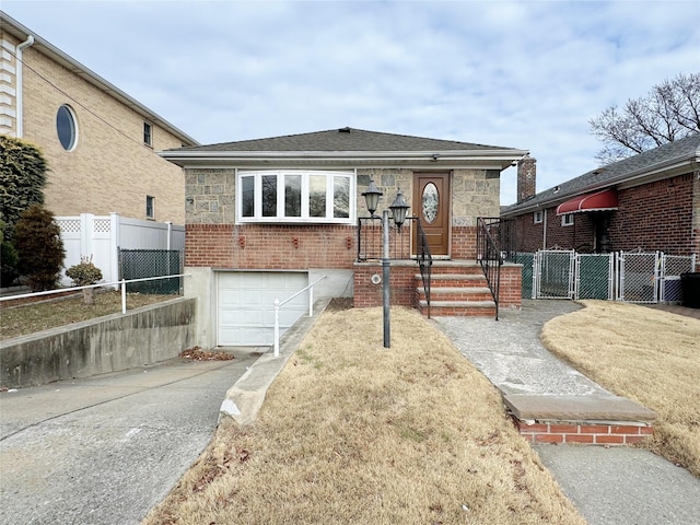 view of front of home with a garage and a front yard