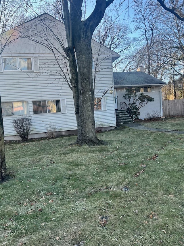 view of home's exterior featuring a yard