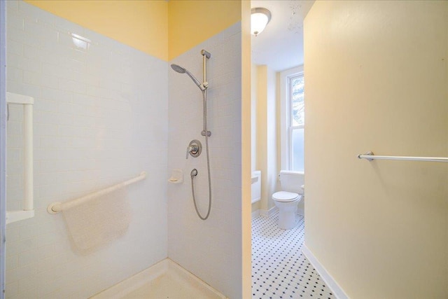 bathroom featuring toilet and a shower