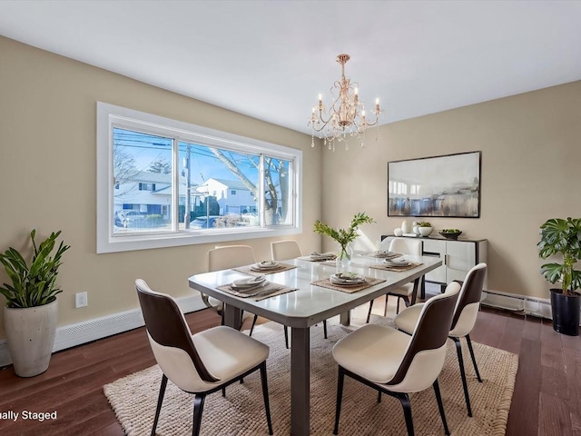 dining space with baseboard heating, a notable chandelier, and dark hardwood / wood-style flooring