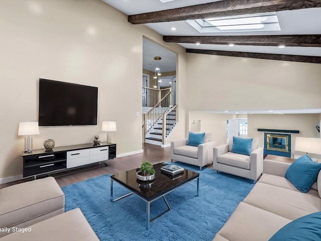 living room featuring vaulted ceiling with beams and dark wood-type flooring