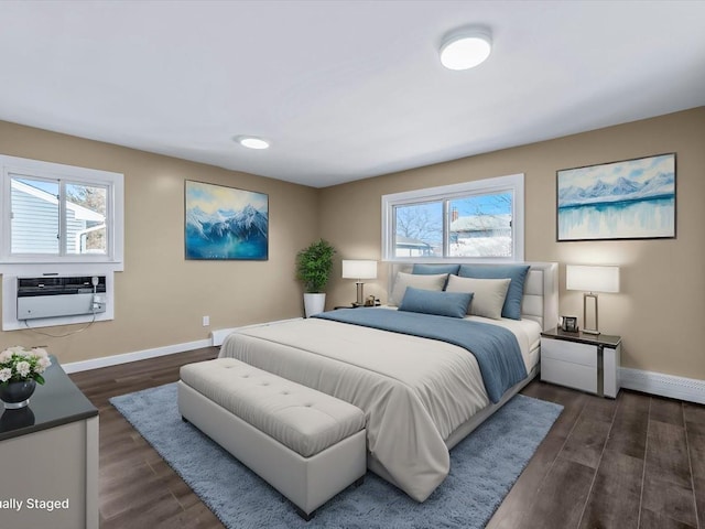 bedroom with an AC wall unit and dark hardwood / wood-style flooring