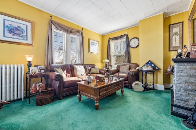 living room featuring ornamental molding, radiator heating unit, and carpet flooring