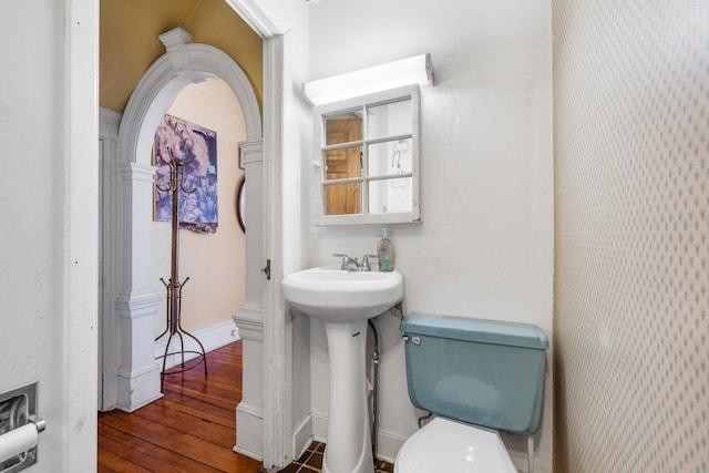 bathroom featuring sink, toilet, and hardwood / wood-style floors