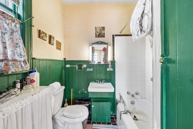 full bathroom with tiled shower / bath, vanity, tile patterned floors, and toilet