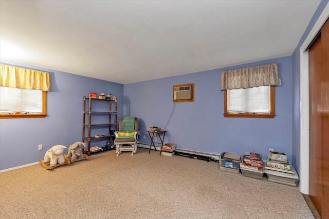 playroom featuring a healthy amount of sunlight, a wall mounted AC, and carpet floors