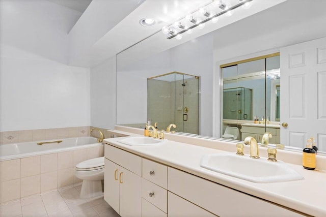 full bathroom with independent shower and bath, vanity, tile patterned flooring, and toilet