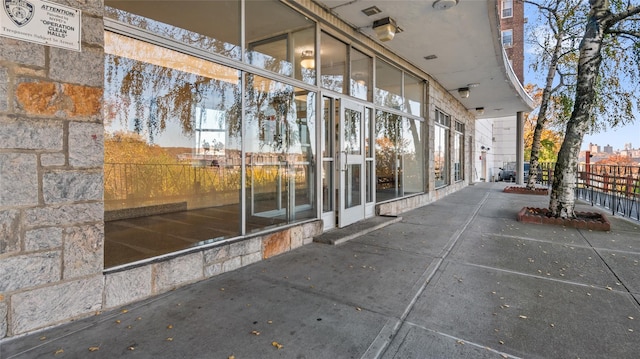 property entrance with a patio area