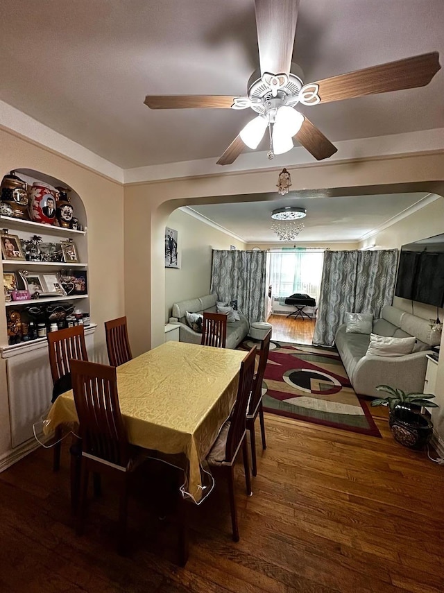 dining area with ceiling fan, hardwood / wood-style flooring, and built in shelves