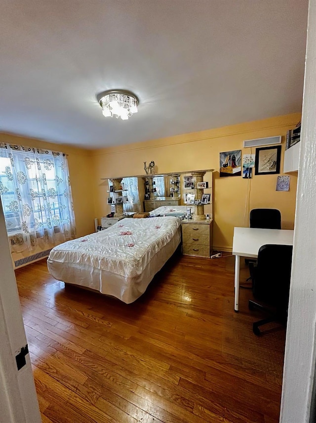 bedroom featuring hardwood / wood-style floors