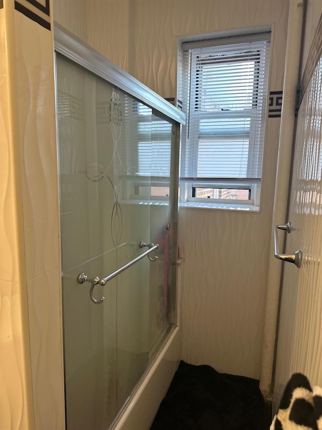 bathroom with a wealth of natural light and an enclosed shower