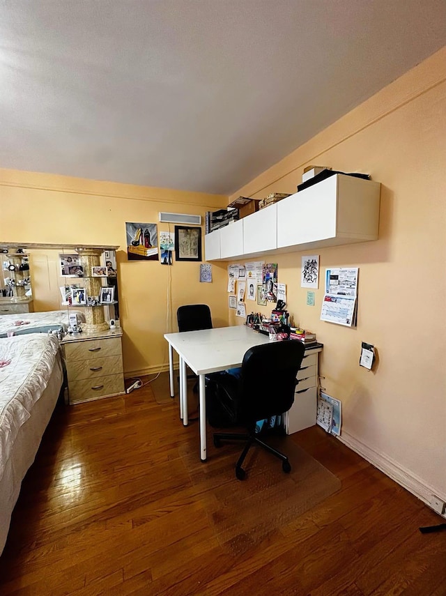 bedroom with dark wood-type flooring