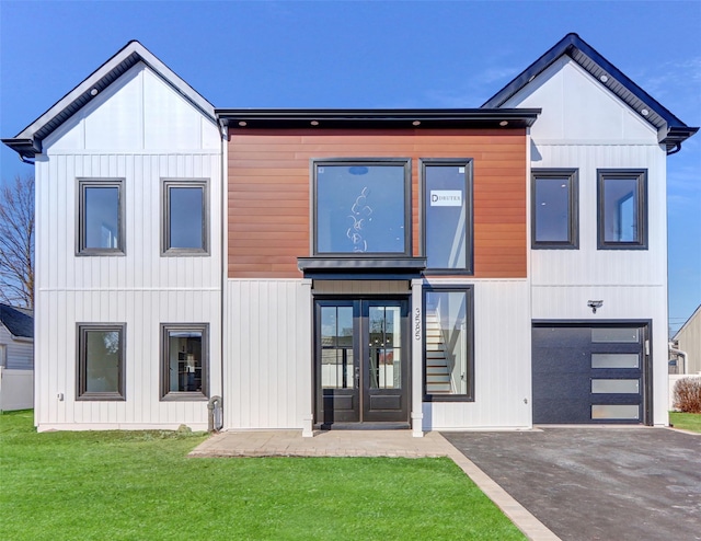 view of front of house with french doors and a front yard