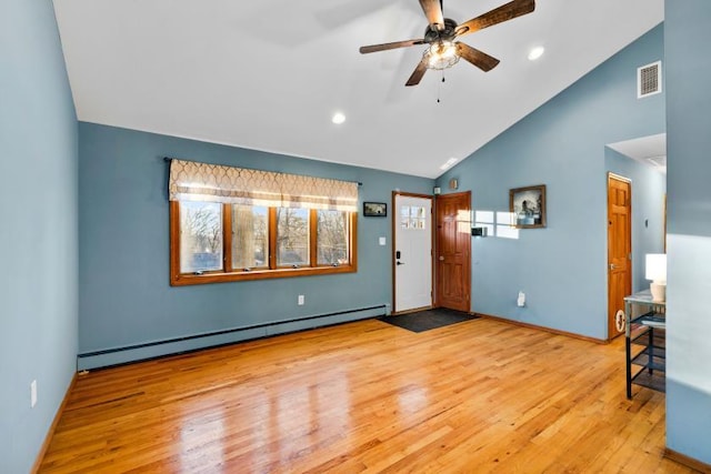 foyer with light wood-type flooring, baseboard heating, high vaulted ceiling, and ceiling fan