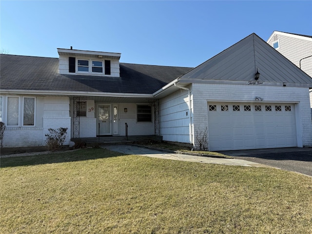 view of front facade with a front lawn and a garage