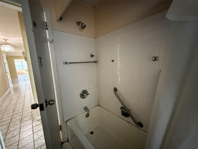 bathroom featuring washtub / shower combination and tile patterned floors