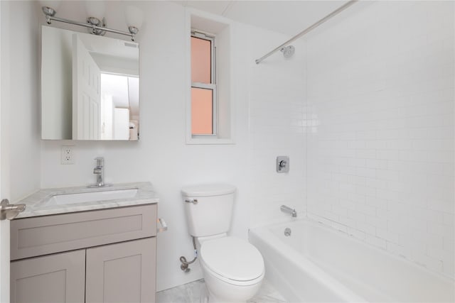 full bathroom with vanity, tiled shower / bath combo, and toilet