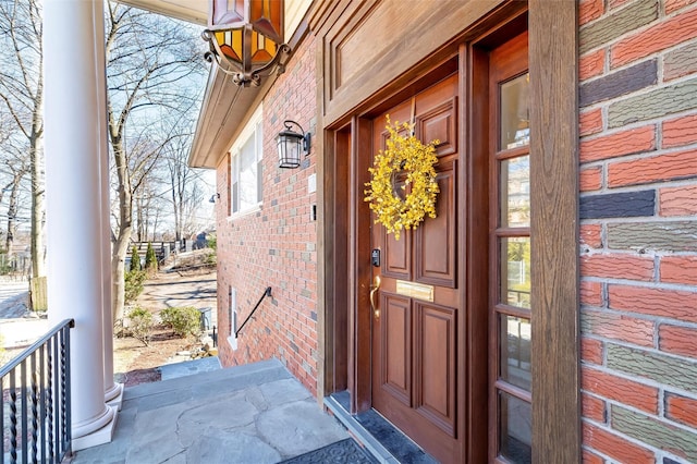 entrance to property with brick siding