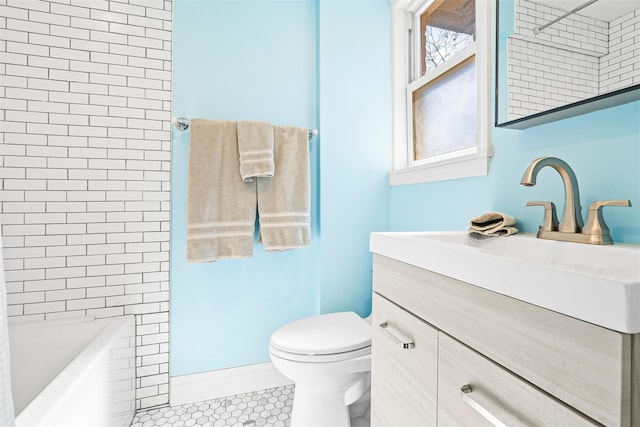 bathroom with tile patterned floors, toilet, and vanity