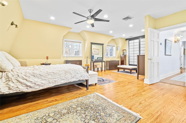 bedroom featuring recessed lighting, visible vents, baseboards, and wood finished floors