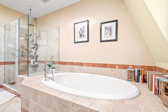 bathroom with a garden tub and a shower stall