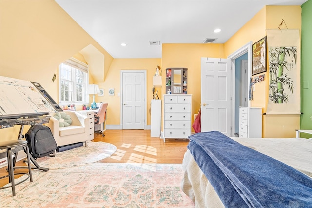 bedroom with recessed lighting, wood finished floors, visible vents, and baseboards