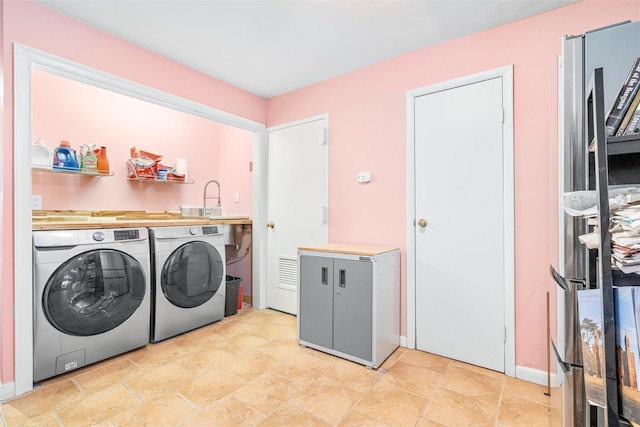 washroom with laundry area and washing machine and clothes dryer