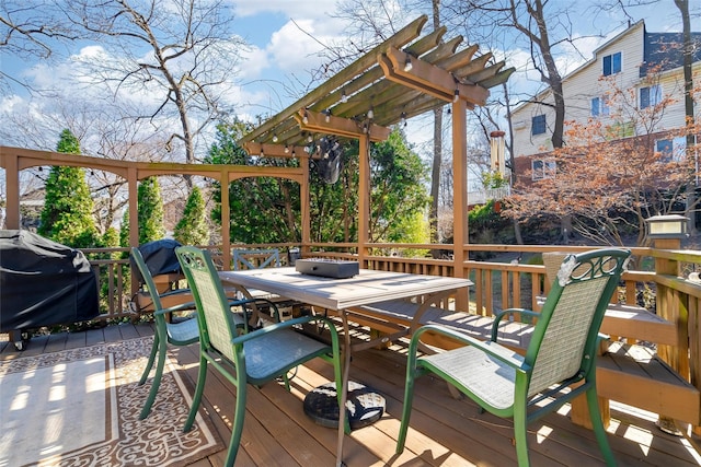 wooden terrace featuring outdoor dining area, a pergola, and a grill